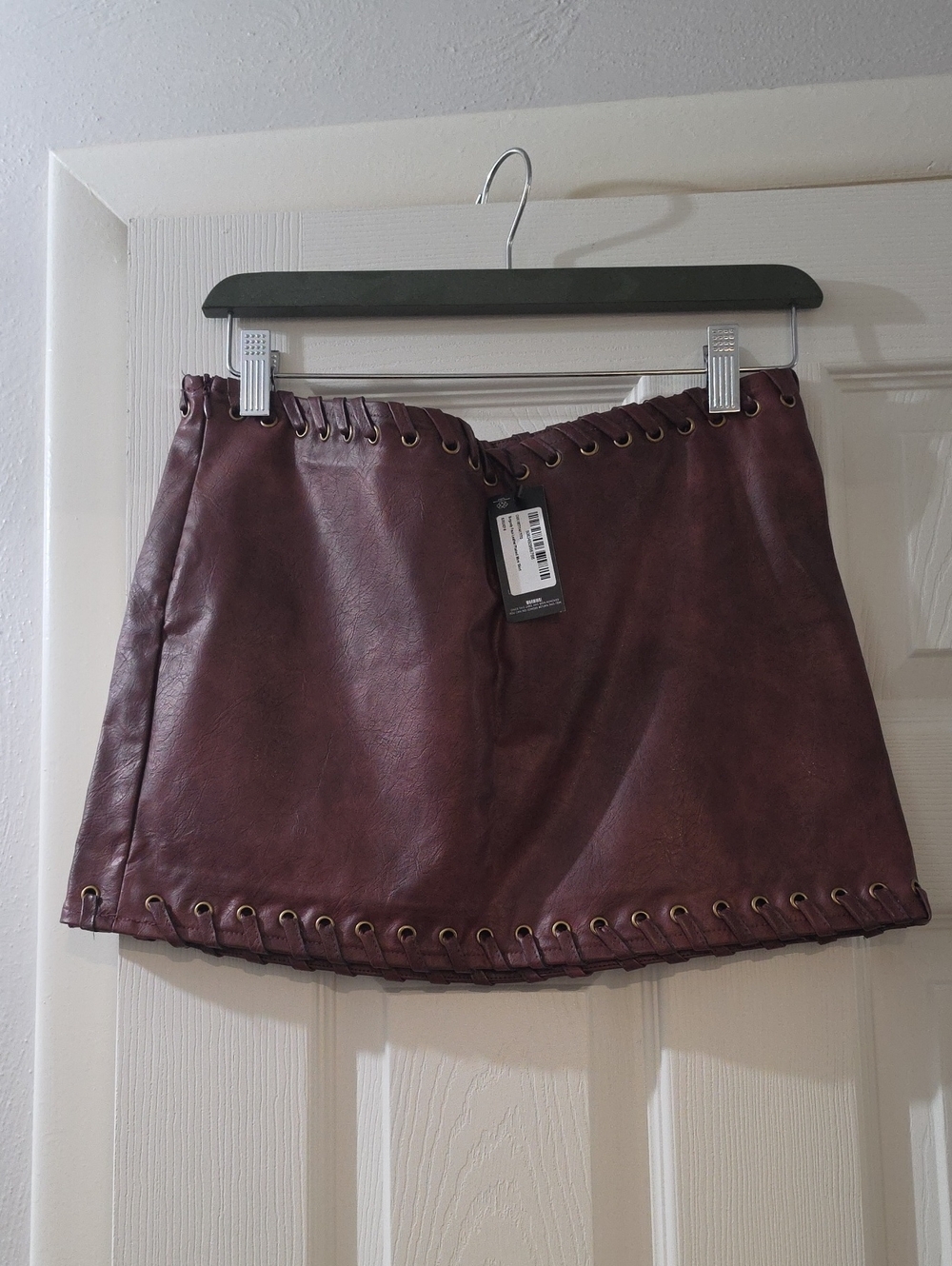 PrettyLittleThing Burgundy Faux Leather Grommet Mini Skirt